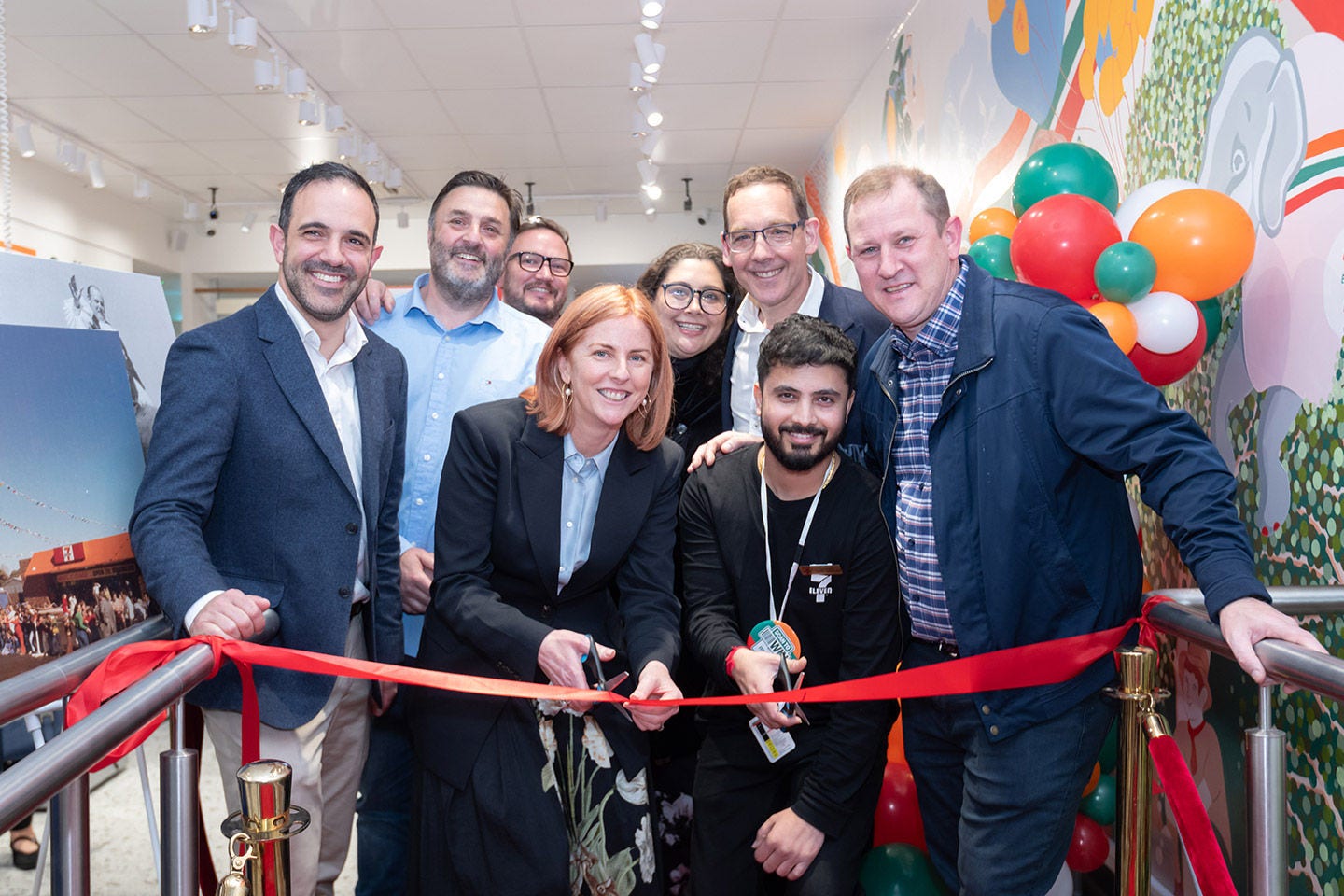 Team celebraing the re-launch of 7-Eleven Oakleigh